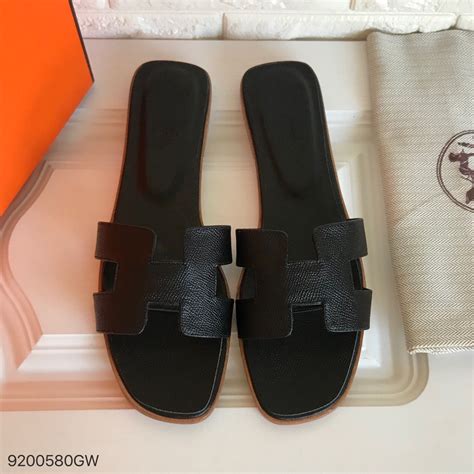 hermes slippers black|women wearing Hermes oran sandals.